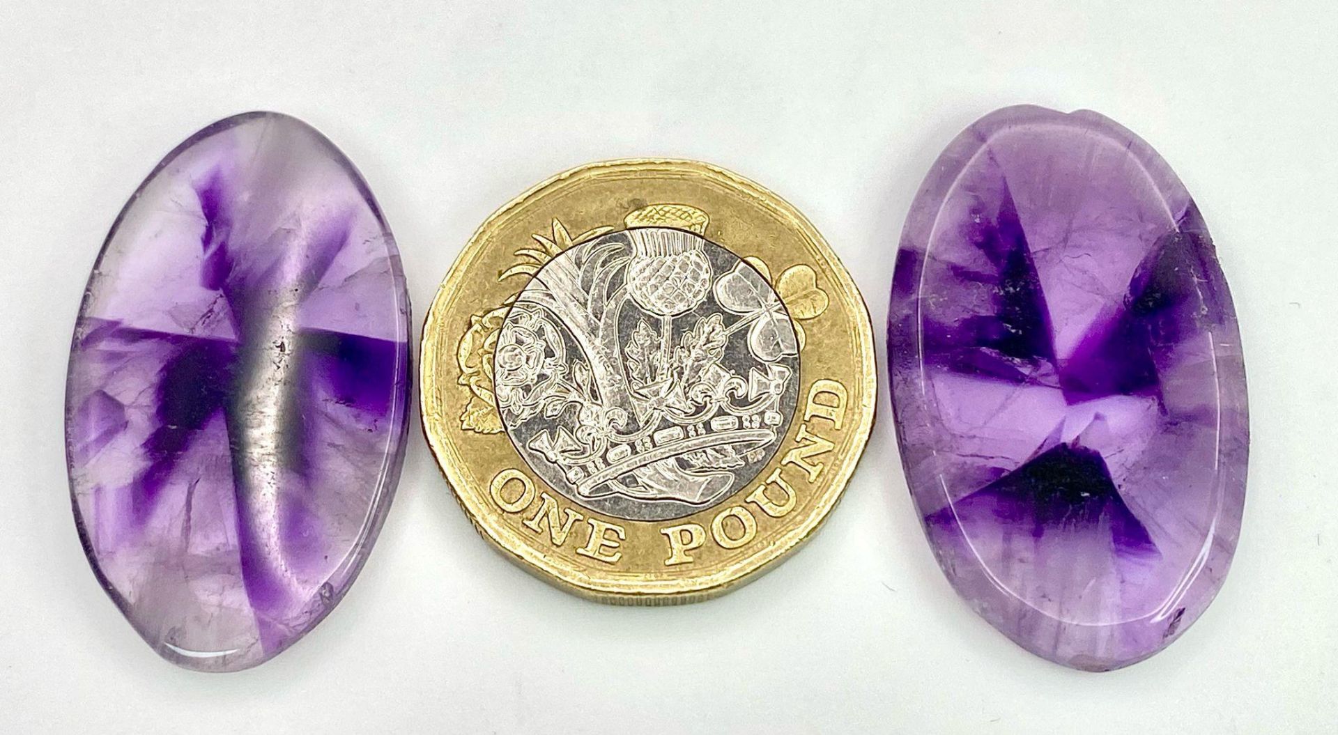 A rarely seen and very desirable pair of large AMETHYST cabochons, exhibiting radiating banded - Image 3 of 3