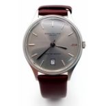 A New (Ex Display) Kenneth Cole, New York Date Watch. Stainless Steel Case, Brown Leather Strap.