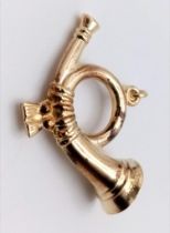 A 9K GOLD BUGLE CHARM . 1.3gms