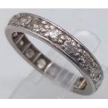 A PLATINUM AND DIAMOND FULL ETERNITY RING . 3.9gms size M