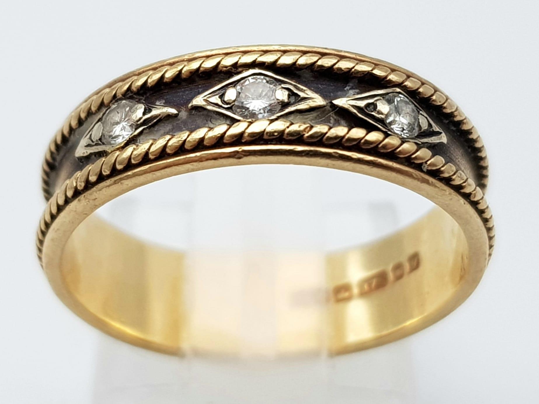 A Vintage 9K Yellow Gold and Diamond Ring. Rope borders with three round cut diamonds. Size O. 2.97g - Image 2 of 4