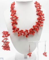 An unusual Arabian Sea red coral necklace, bracelet and earrings set in a “Cloud” design,