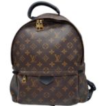 A Louis Vuitton Monogram 'Palm Springs' Backpack. Leather exterior with gold-toned hardware, a