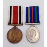 A Special Constabulary Long Service Medal (GVR 1 st type) named to: Cecil M Green, together with a