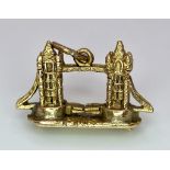 A 9K GOLD TOWER BRIDGE CHARM WITH MOVING PARTS . 3.2gms