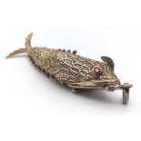 A vintage sterling silver articulated fish pendant with Ruby eyes that converted into snuff box.