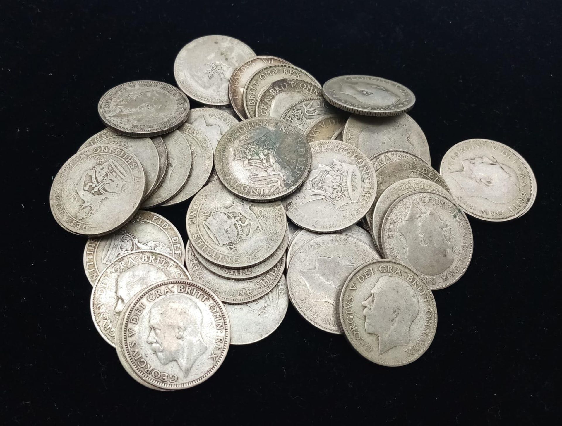 41 Pre 1947 British Silver Shilling Coins. 222g total weight. Please see photos for finer details.