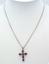 A vintage 925 silver Garnet cross pendant on silver chain. Total weight 6G. Total length 40cm.