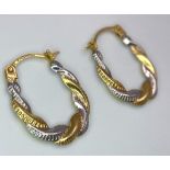 A Pair of 9K Bi-Colour Gold Oval Hoop Twist Earrings. 0.44g weight.