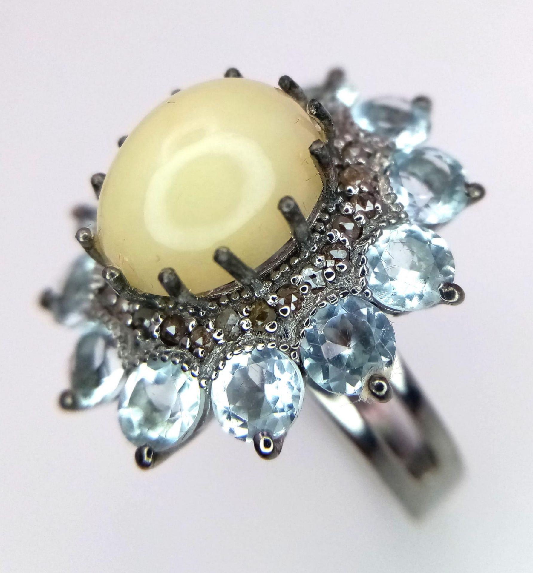 An Opal and Diamond Ring with Aquamarine Accents on 925 Silver. 2.88ct opal, 0.40ctw diamonds, 3. - Image 2 of 6