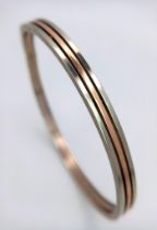 A 9K White and Rose Gold Three Row Bangle. 7cm inner diameter. 9g weight.