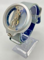 A Verticale Mechanical Top Winder Gents Watch. Pale blue leather strap. Silver tone ceramic gilded