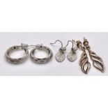An electic collection of 3 stylist pair of silver earrings. Total weight 5.6G. Please see photos for