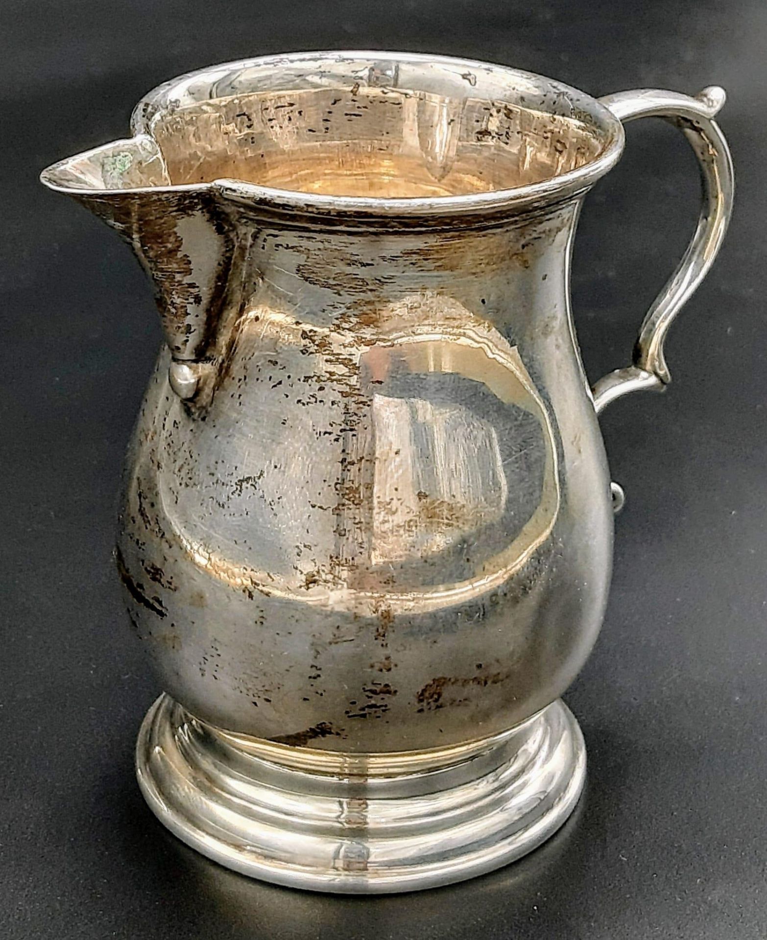 An Antique Sterling Silver Creamer Jug. Hallmarks for London 1924. Makers mark of Charles and