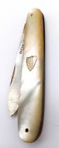 An antique sterling silver Mother of Pearl folding fruit knife. Full hallmarks Sheffield, 1930.