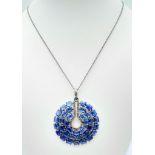 A Kyanite Pendant with Diamond Accents on a 925 Silver Chain. 24ctw kyanites, 0.55ctw diamonds.