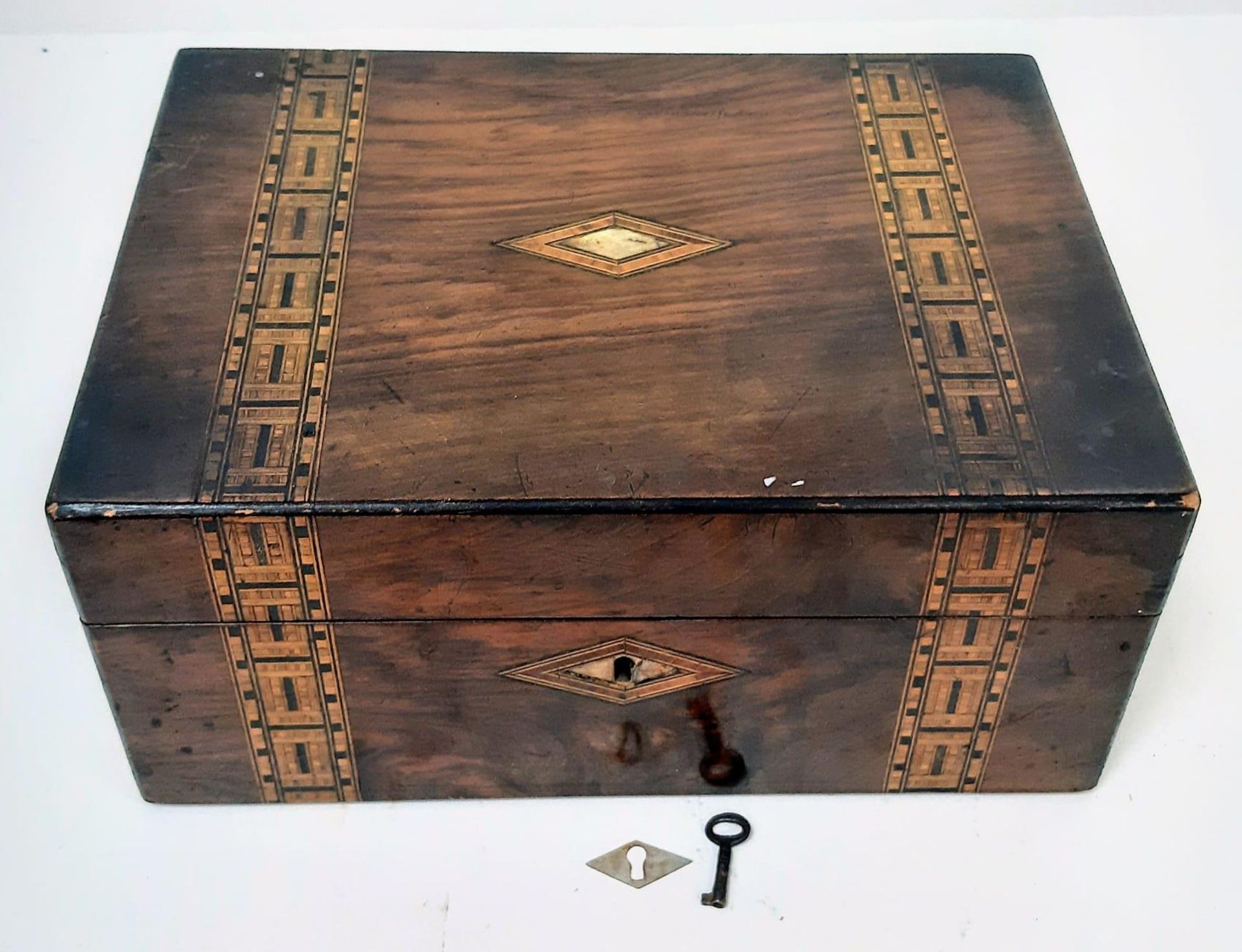 A BEAUTIFULLY INLAID WOODEN BOX 30 X 21 X 13cms WITH MOTHER OF PEARL INLAY TO TOPSIDE. INTERIOR NEED