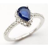 An 18K White Gold, Diamond and Sapphire Pear-Shaped Cluster Ring. 0.65ct sapphire. Size M 1/2. 3.