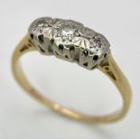 An 18 K yellow gold ring with a trilogy of diamonds, size: K1/2, weight: 1.9 G.