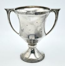 An antique sterling silver trophy with full Birmingham hallmarks, 1934. Total weight 164.5G.