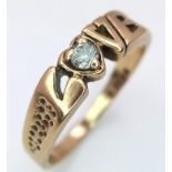 A 9K Yellow Gold 'Love' Ring with White Stone Decoration. Size O/P. 2.52g weight.