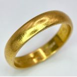 A Vintage 22K Yellow Gold Band Ring. 4mm width. Size O. 5.32g weight. Full UK hallmarks.