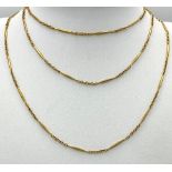 An unusual, 9 K yellow gold and very long (100 cm) chain necklace, that can be worn either as one