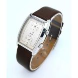A Vintage Dunhill Quartz Dual Time Watch. Brown leather strap. Stainless steel case - 28mm.