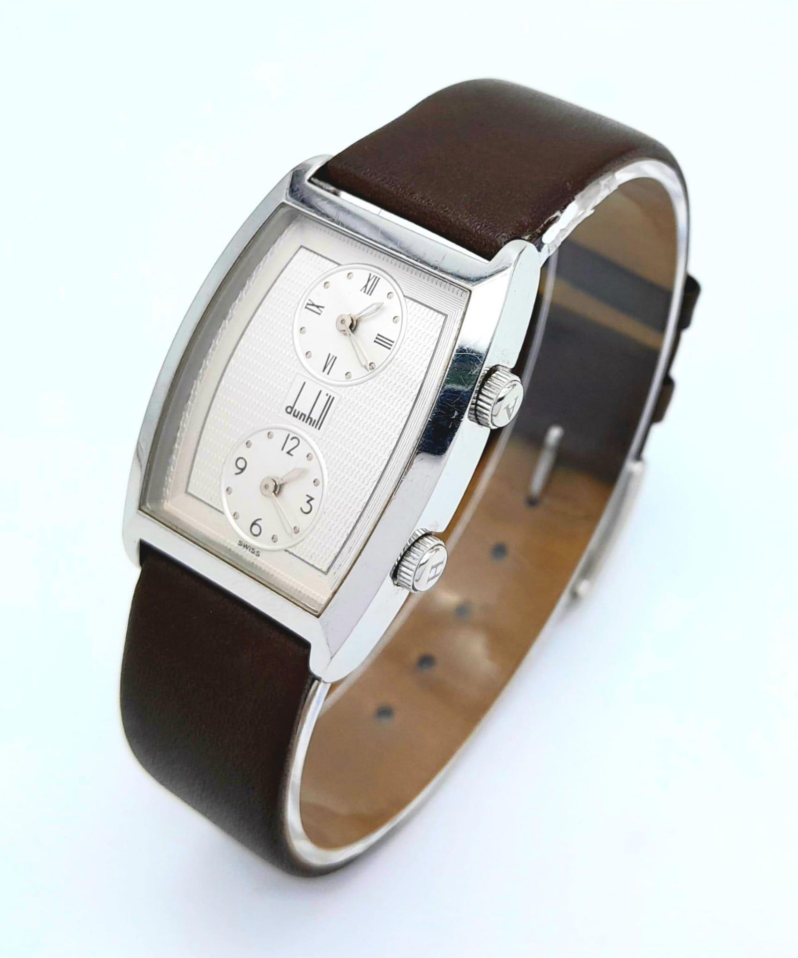 A Vintage Dunhill Quartz Dual Time Watch. Brown leather strap. Stainless steel case - 28mm.