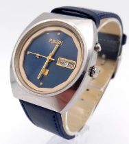 A Vintage Ricoh Automatic Gents Watch. Blue leather strap. Stainless steel case - 37mm. Blue dial