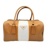 A Prada beige/white perforated leather Bauletto satchel. Gold tone hardware, feet to base, no