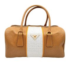 A Prada beige/white perforated leather Bauletto satchel. Gold tone hardware, feet to base, no