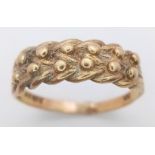 A Vintage 9K Yellow Gold Keeper Ring. Size U. 2.92g weight.