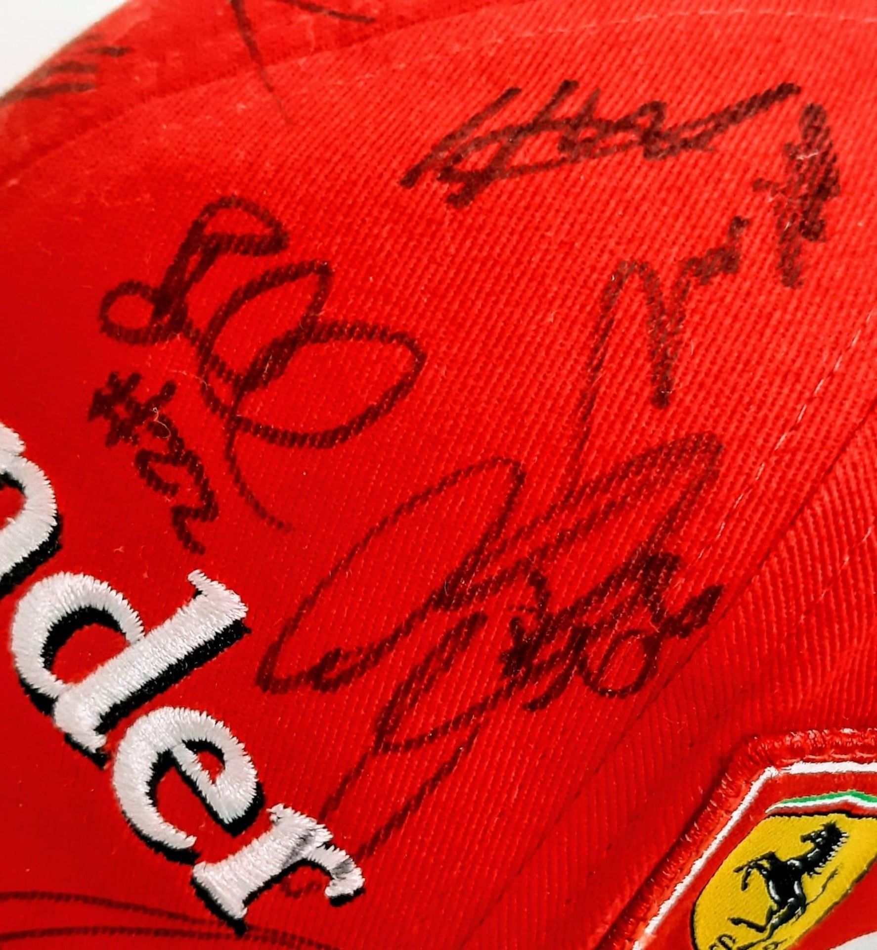 An Official Ferrari Team Cap - Over 20 signatures including Ferrari drivers and team principals. - Image 13 of 14