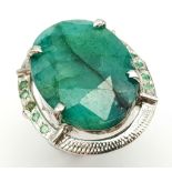 A Brazilian Oval Cut Emerald Ring set in 925 Sterling silver. W-16.80g. 65ct emerald. Size O. Ref: