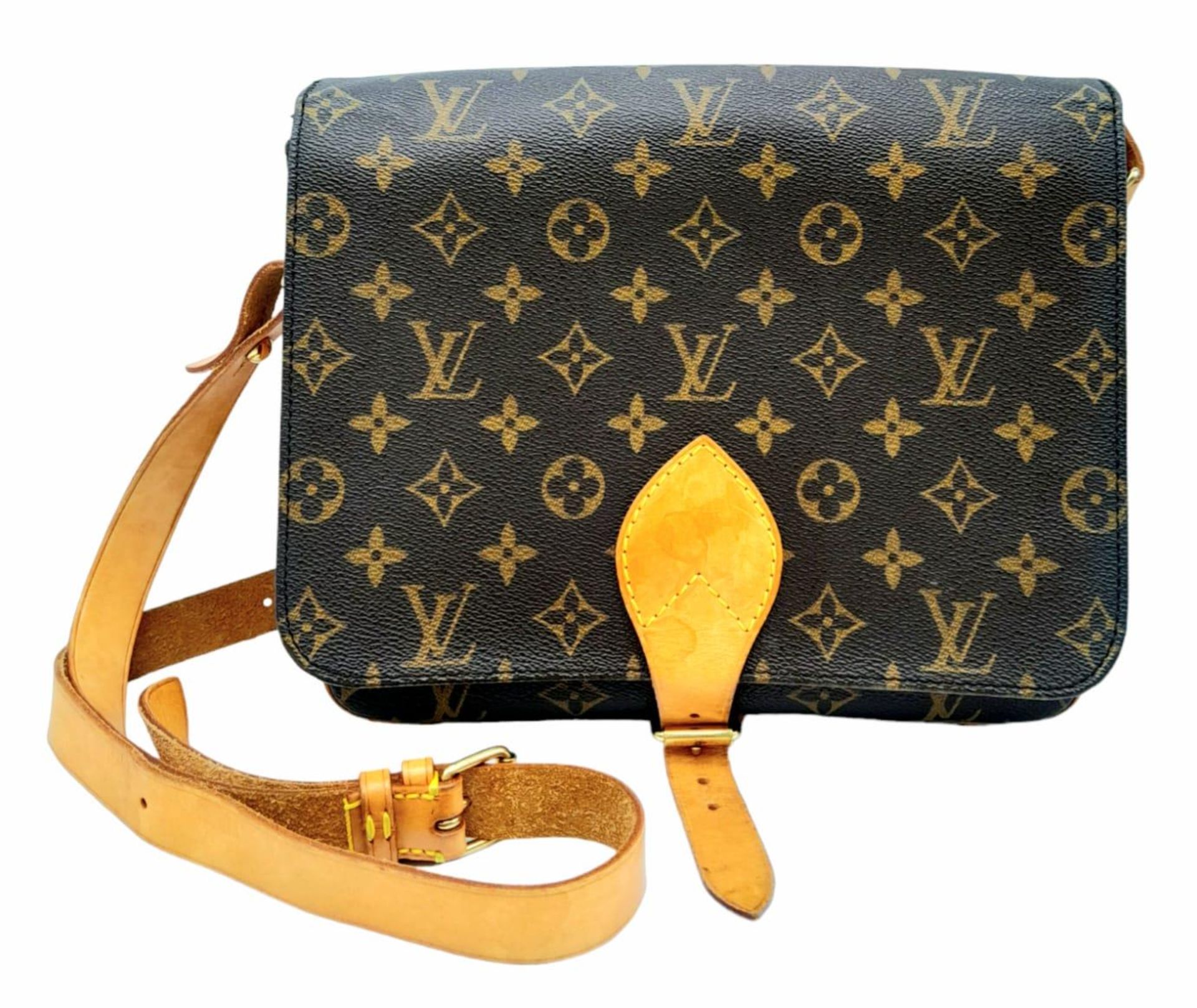 A Vintage Louis Vuitton Cartouchiere Shoulder Bag. LV monogram canvas exterior with cow-hide leather