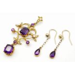 An ART NOUVEAU 9 K yellow gold pendant with vivid coloured amethysts and natural seed pearls,