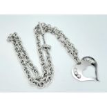 A Sterling Silver Heart Pendant on a Silver Chain. 3cm pendant. 46cm chain. 22g total weight.