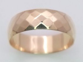 A 9K Yellow Gold Faceted Wedding Band. Size N 1/2. 2.7g total weight.