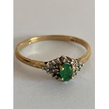 9 carat GOLD,DIAMOND and EMERALD RING. Full UK hallmark. Complete with ring box. 2.1 grams. Size V –