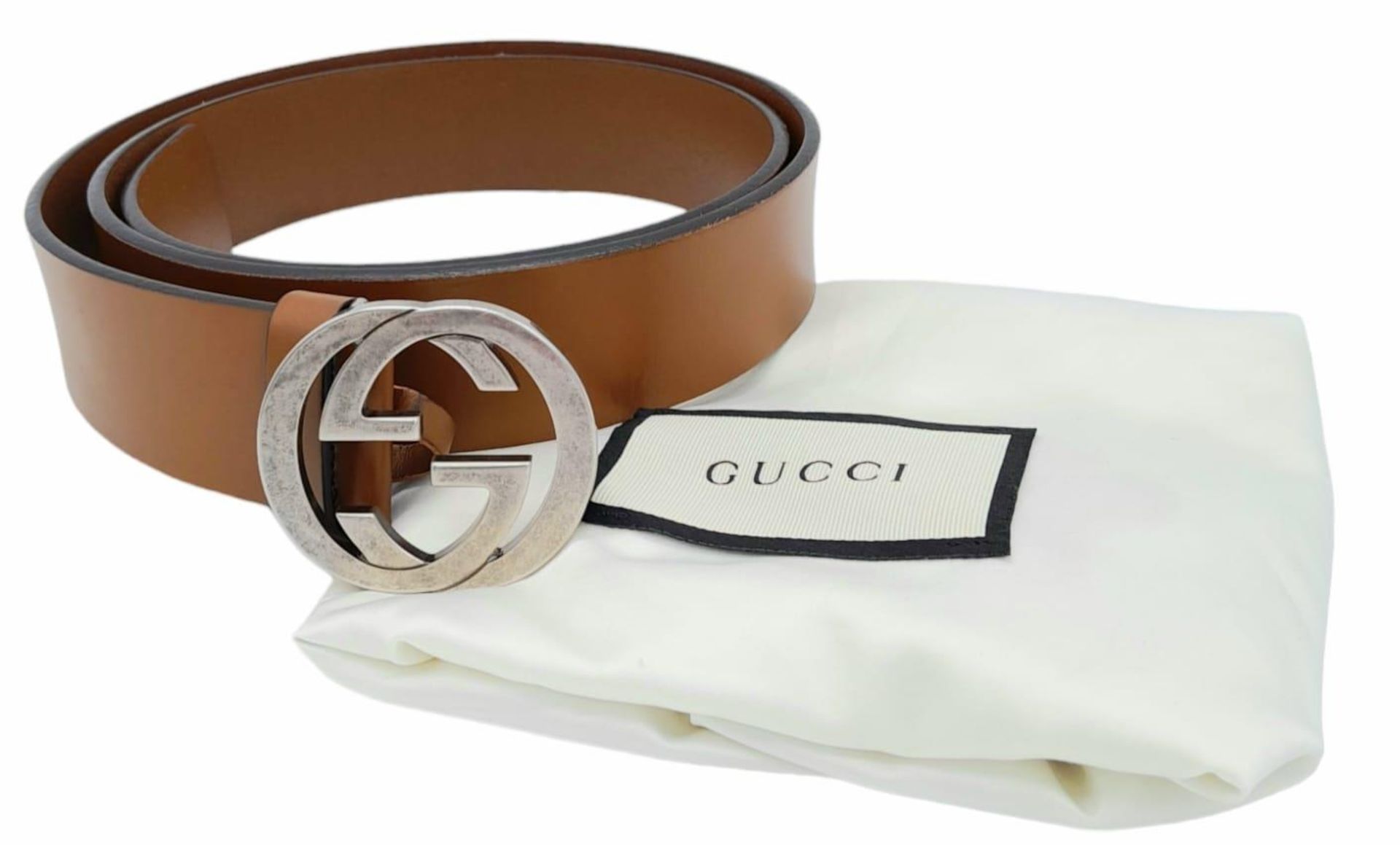 A Gucci Interlocking GG Signature Leather Belt. Brown Calfskin Leather, Silver Tone Hardware.