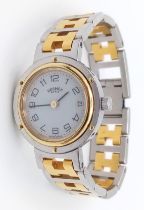 A Designer Hermes Quartz Ladies Watch. Two tone stainless steel bracelet and case - 25m. White