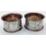 A Pair of Antique Sterling Silver Napkin Rings. Beautifully decorated with empty cartouche.