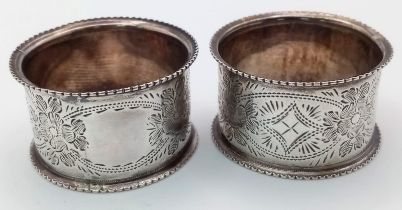 A Pair of Antique Sterling Silver Napkin Rings. Beautifully decorated with empty cartouche.