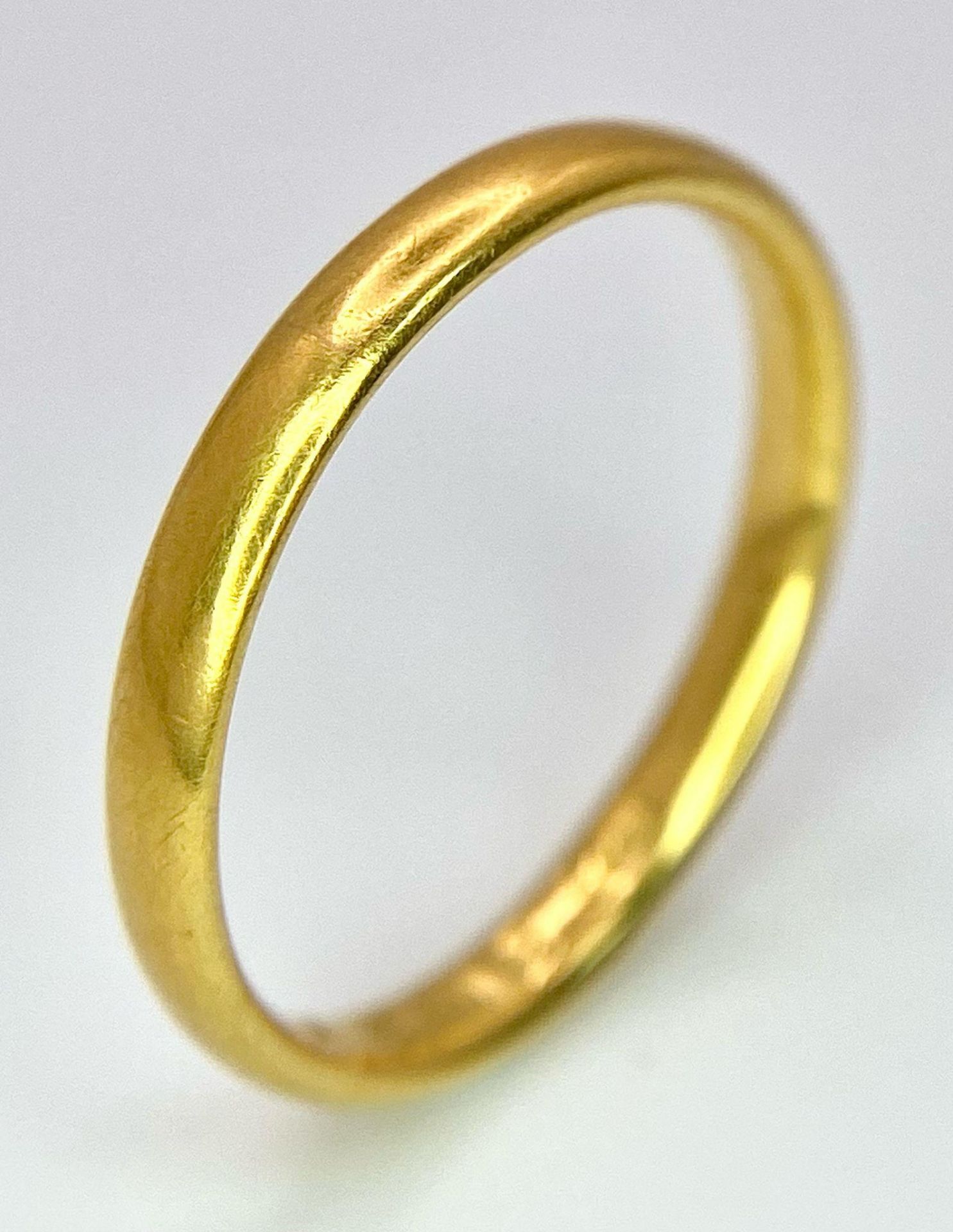 A Vintage 22k Yellow Gold Band Ring. 3mm width. Size L. 2.85g weight. Full UK hallmarks.
