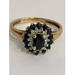 Stunning 9 carat GOLD ,SPINEL and DIAMOND RING. Consisting an oval cut BLACK SPINEL to centre with