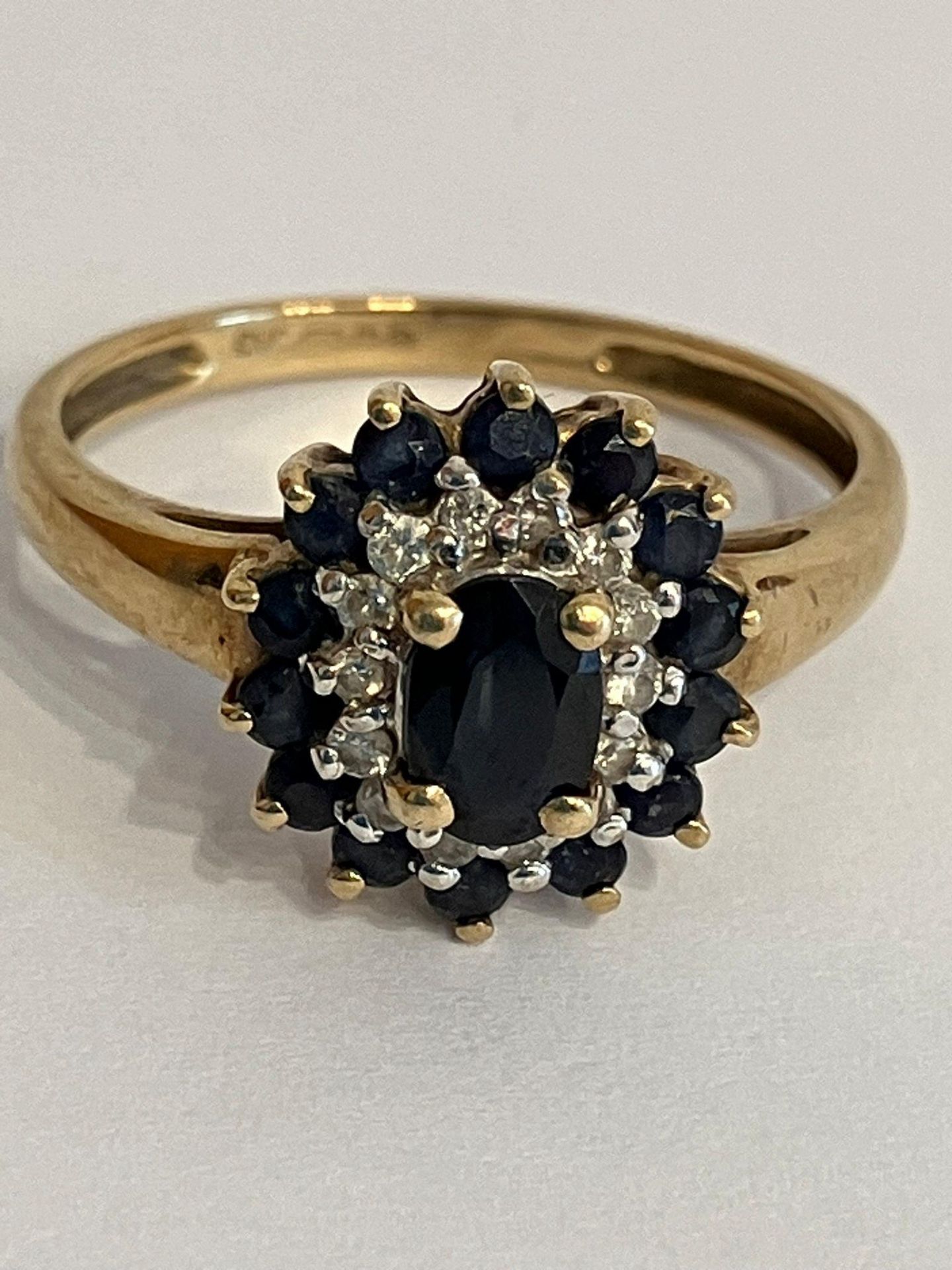 Stunning 9 carat GOLD ,SPINEL and DIAMOND RING. Consisting an oval cut BLACK SPINEL to centre with