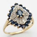 A 9K Yellow Gold Diamond and Sapphire Cluster Ring. Size O. 3.3g total weight.