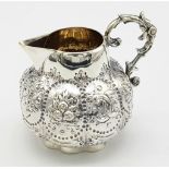 A SMALL SOLID SILVER JUG WITH THE INSCRIPTION "XMAS 1899" ALTHOUGH THE HALLMARK IS DATED 1891 WITH