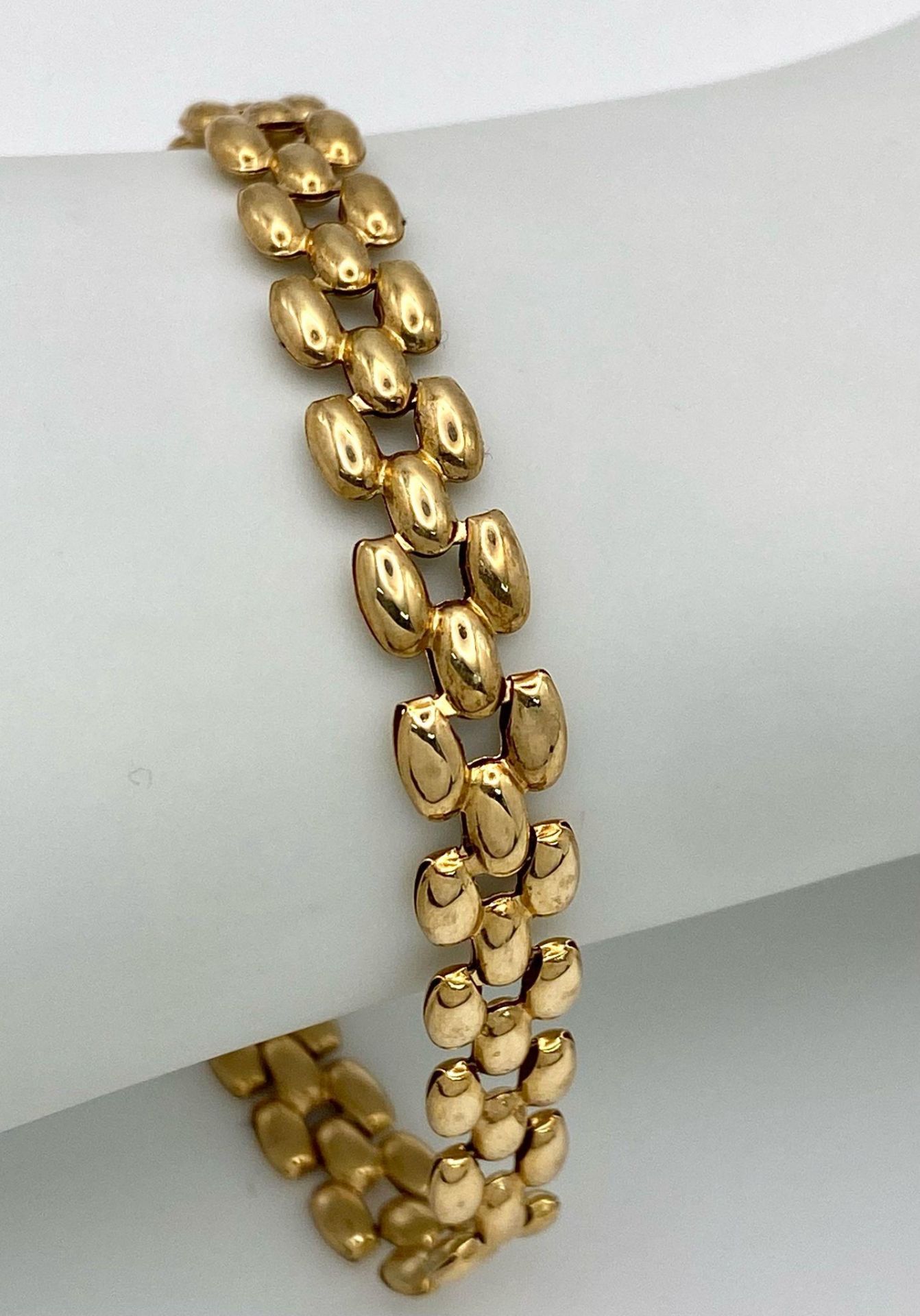 A 9K Yellow Gold Three-Row Link Bracelet. 18cm. 4.5g weight
